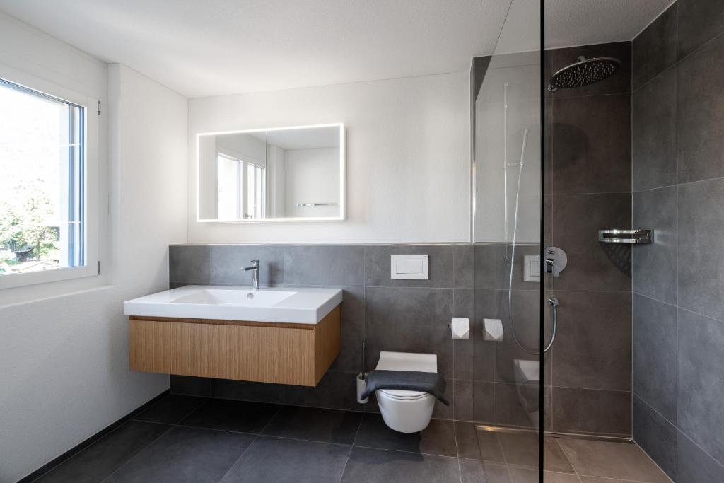 Koupelna v ubytování Neubauwohnung mit Lift in Matten