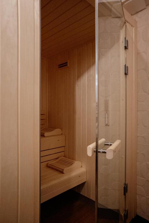 a bathroom with a shower with a toilet and stairs at Hôtel Riesner in Paris