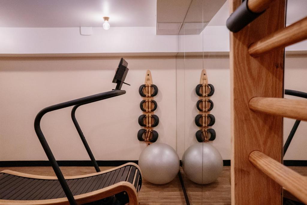 a room with a chair and spheres on the wall at Hôtel Riesner in Paris