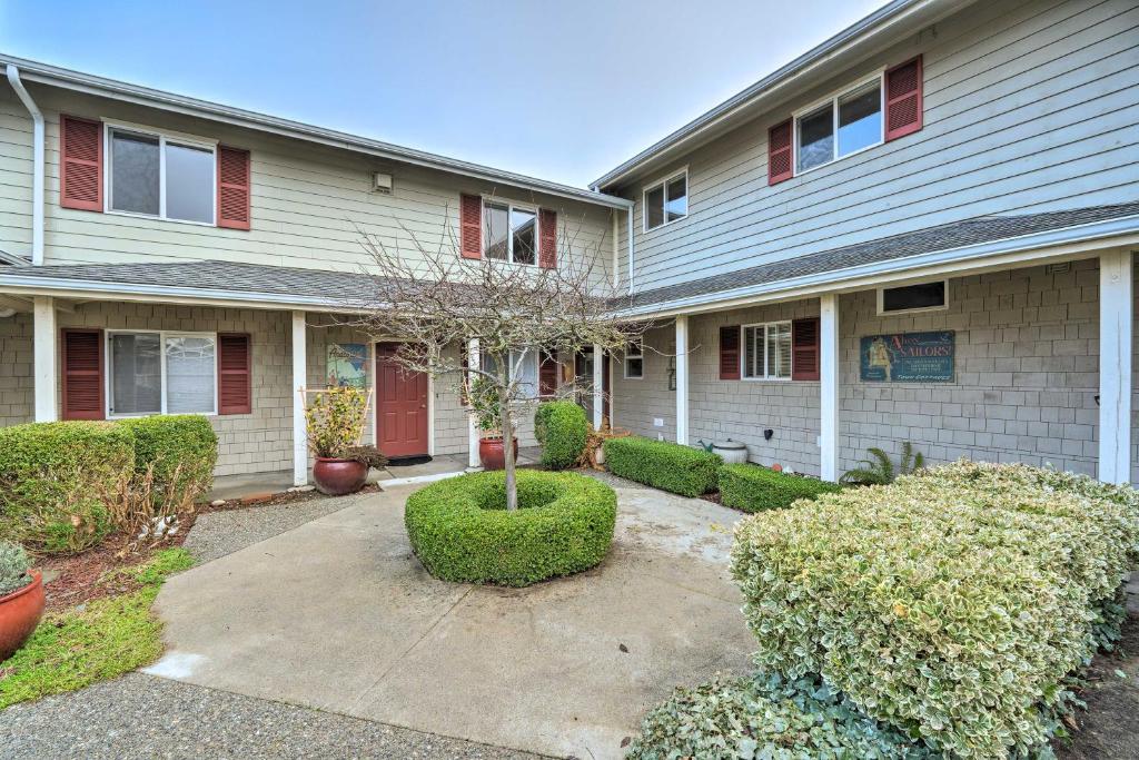 a house with a driveway in front of it at Anacortes Condo - Walk to Town, Marina, and Bay! in Anacortes