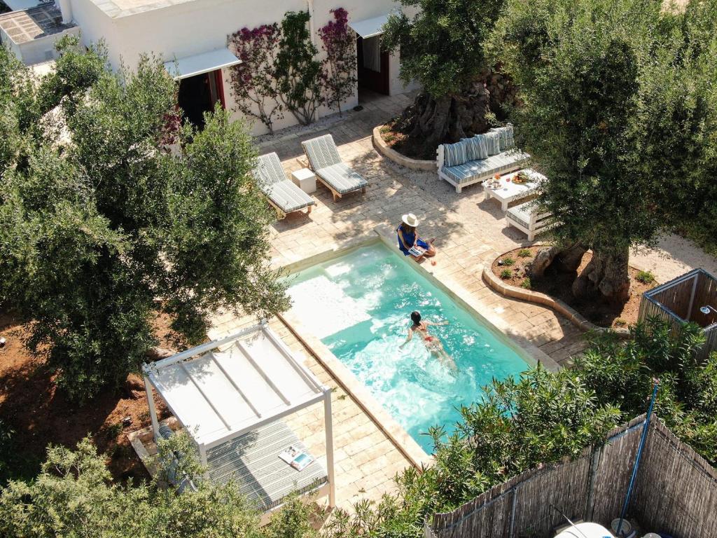 The swimming pool at or close to Masseria Torre Coccaro