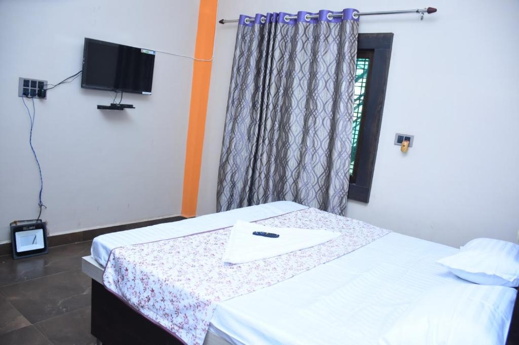 Postel nebo postele na pokoji v ubytování Signature Inn Orchha