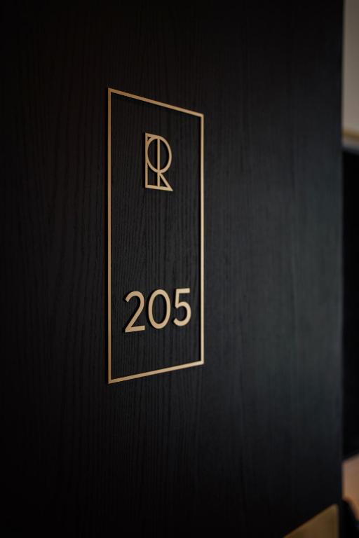 a door with a sign that says rds on it at Hôtel Riesner in Paris