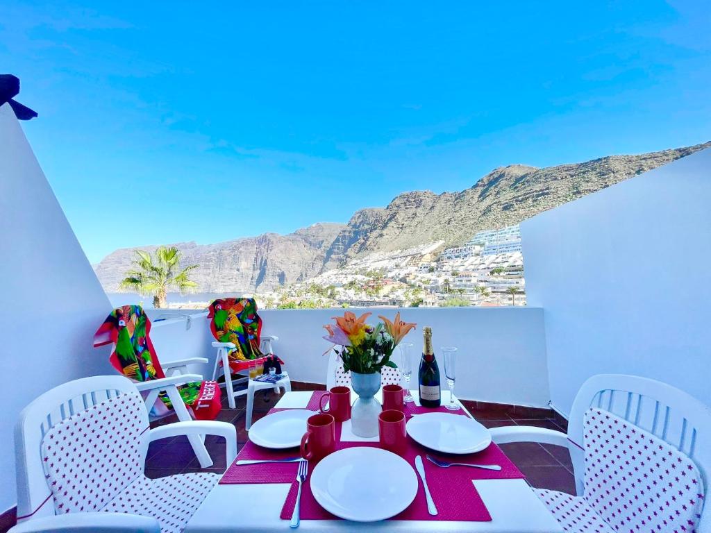 a dining room with a table and chairs at Seaview Townhouse in Puerto Santiago & Los Gigantes in Puerto de Santiago