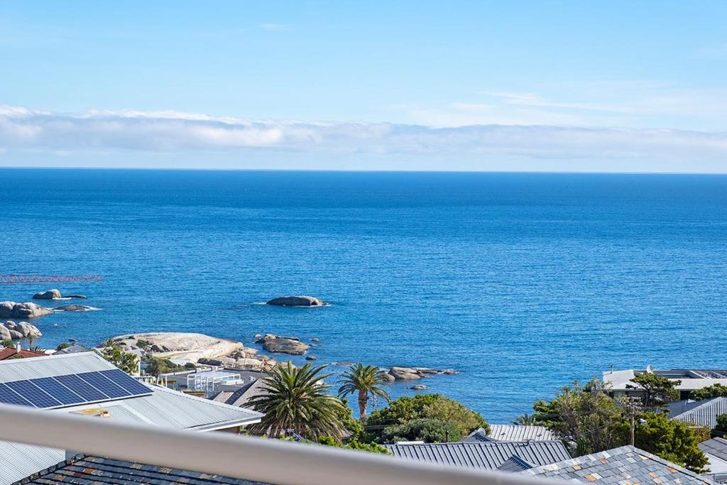 a view of the ocean from a balcony at Stunning Sea View Apartment - Camps Bay in Cape Town
