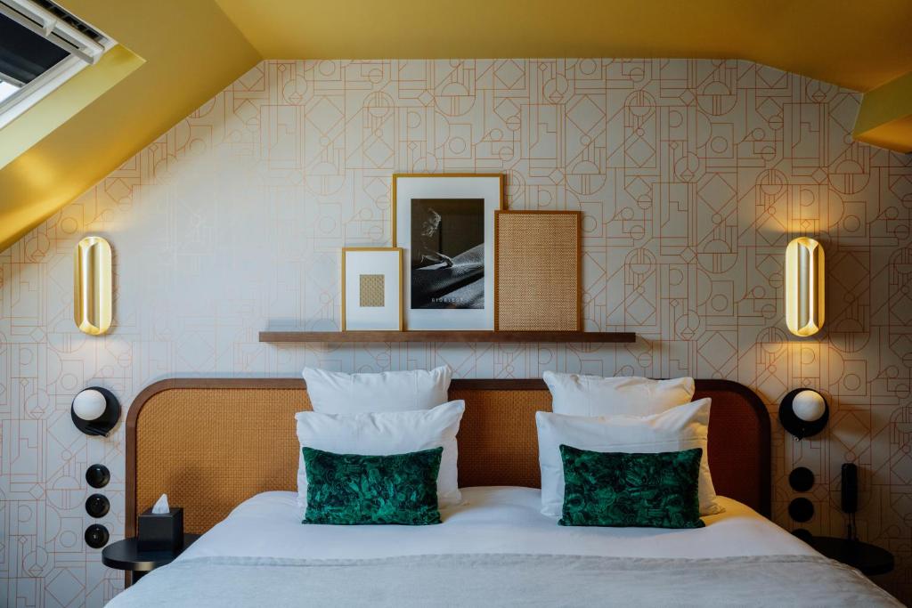 Postel nebo postele na pokoji v ubytování Hôtel Riesner
