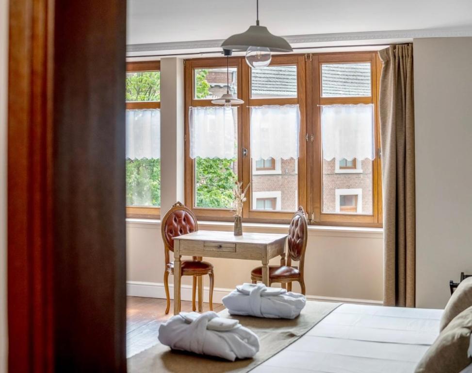 Postel nebo postele na pokoji v ubytování Café René Borgloon