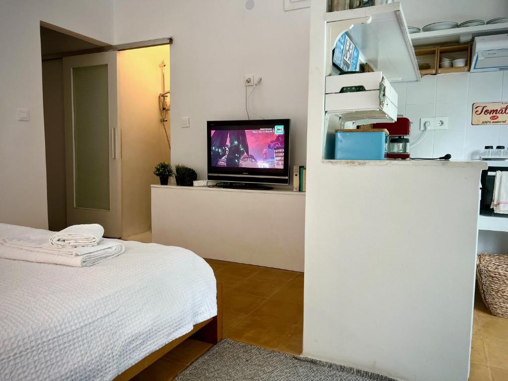 Kuchyň nebo kuchyňský kout v ubytování Cozy Studio the original