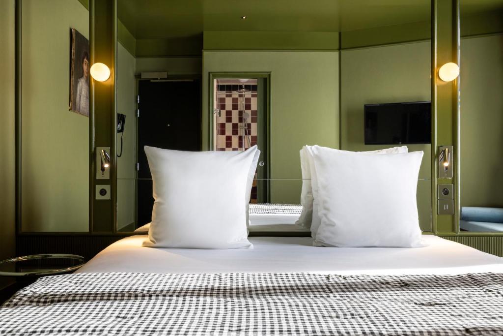 Postel nebo postele na pokoji v ubytování Hôtel La Conversation