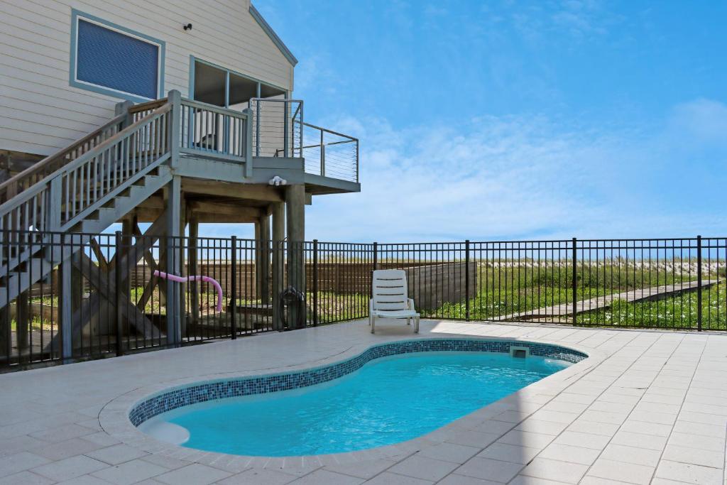 a house with a swimming pool and a deck at Indian Summer in Indian Pass