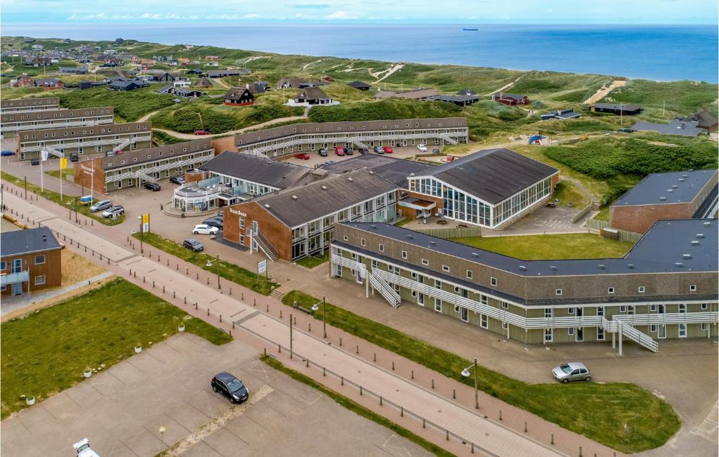 an aerial view of a building with a parking lot at Beautiful Apartment In Ringkøbing in Ringkøbing