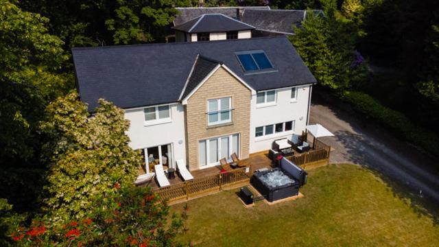 an aerial view of a large white house with a porch at Chapelhill in Helensburgh