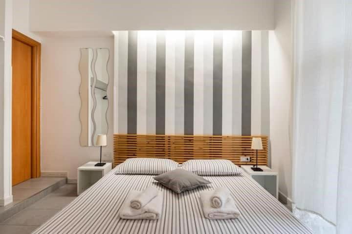 A bed or beds in a room at St Peter Rooms