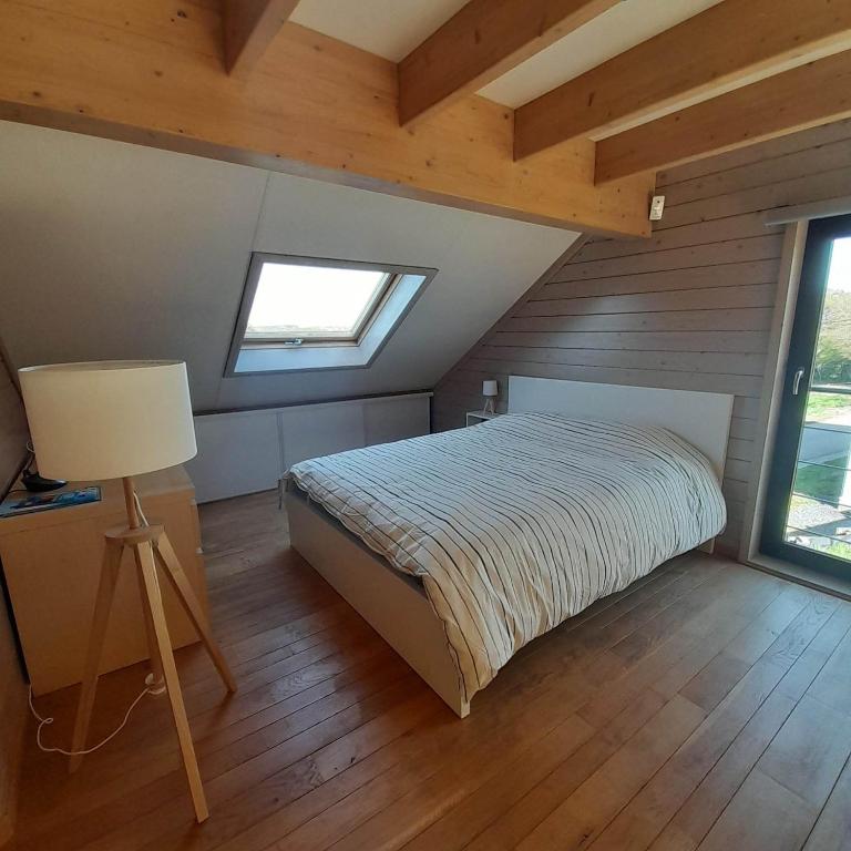 Postel nebo postele na pokoji v ubytování Le gîte Pierre et Bois