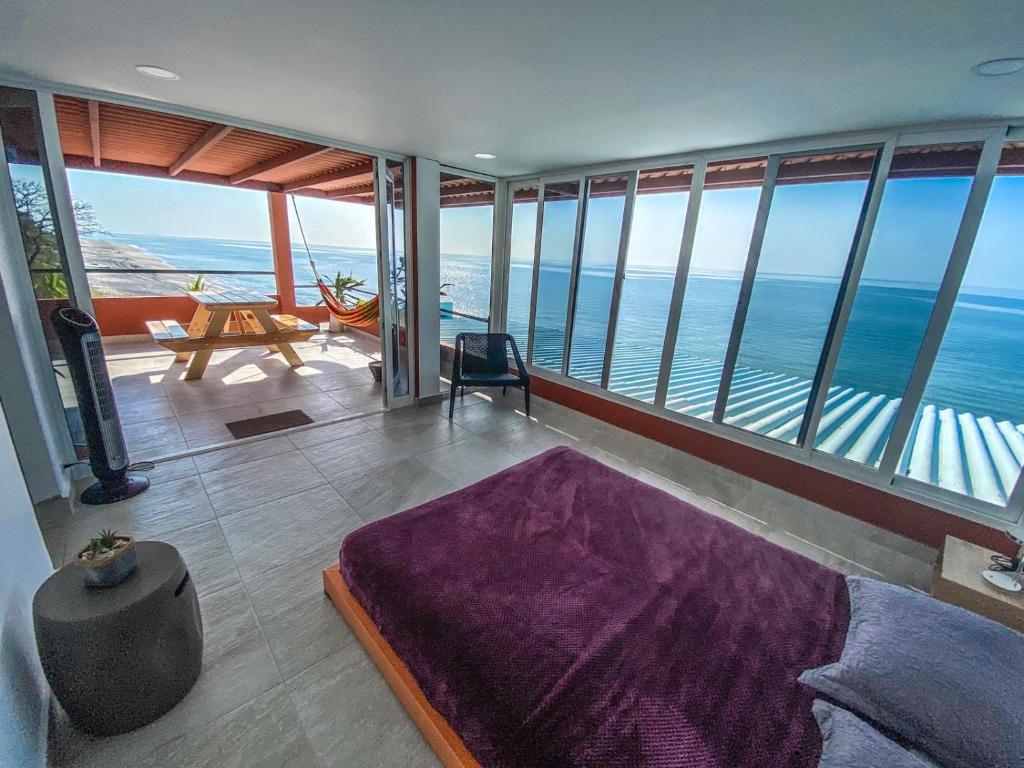 a living room with a view of the ocean at Malibu Rooftop in Nueva Gorgona