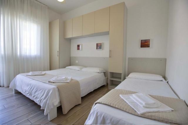 Postel nebo postele na pokoji v ubytování Hotel Elite