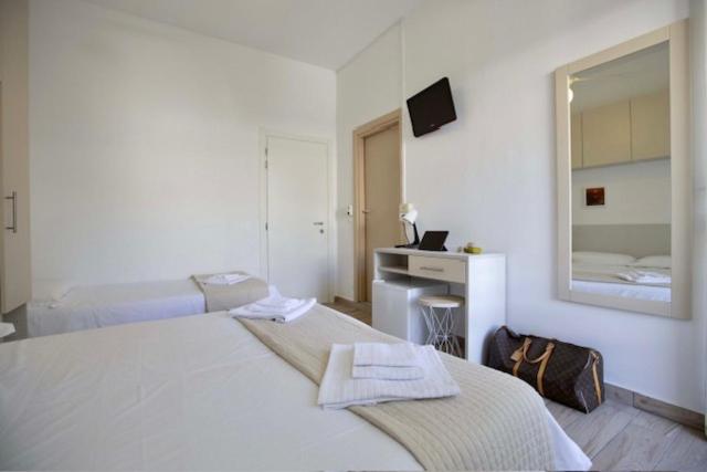Postel nebo postele na pokoji v ubytování Hotel Elite