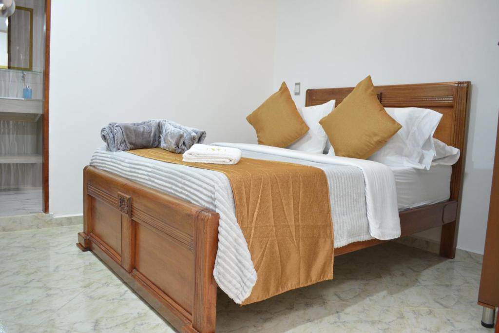Postel nebo postele na pokoji v ubytování HOTEL EL VALENCIA