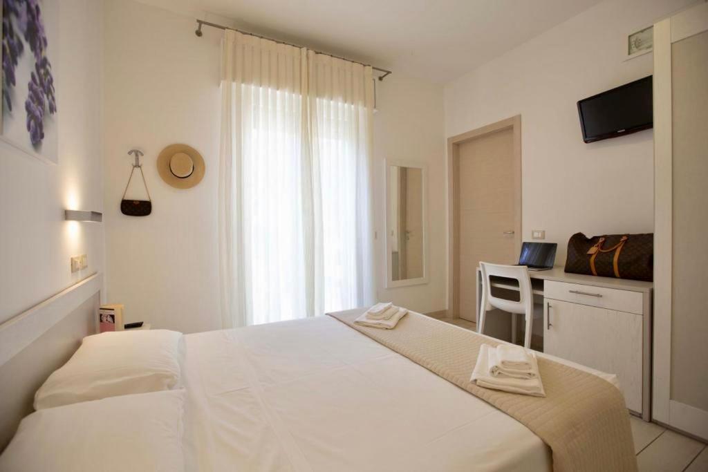 Postel nebo postele na pokoji v ubytování Hotel Elite