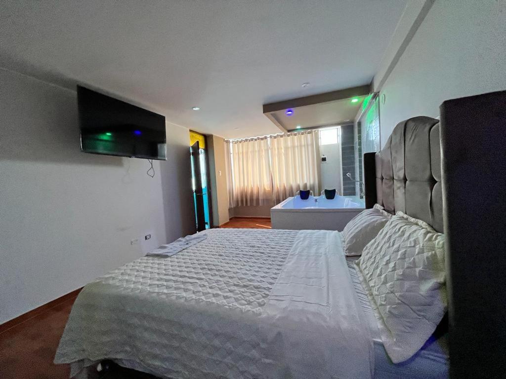 Voodi või voodid majutusasutuse HOSTAL SAUNA 40 GRADOS toas