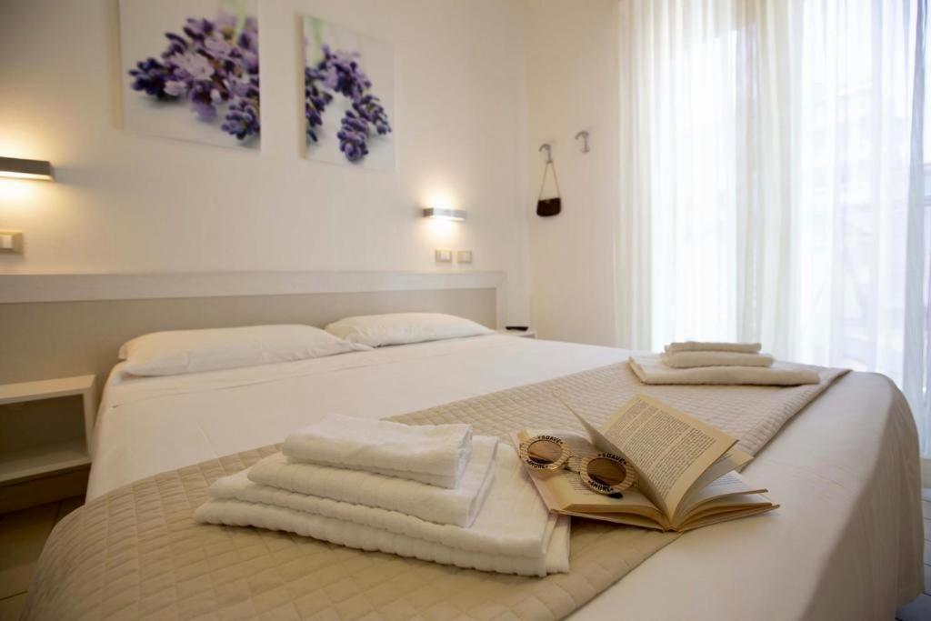 Postel nebo postele na pokoji v ubytování Hotel Elite