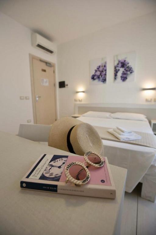 Postel nebo postele na pokoji v ubytování Hotel Elite