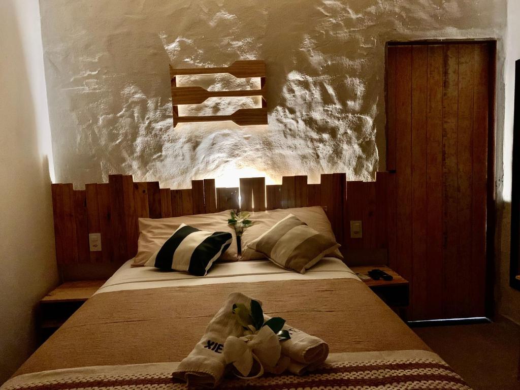 Postel nebo postele na pokoji v ubytování Chalés XIÉ