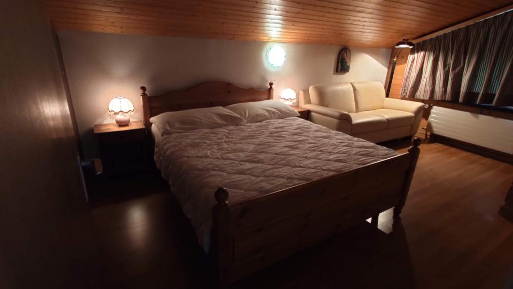 Postel nebo postele na pokoji v ubytování Chalet Rezia