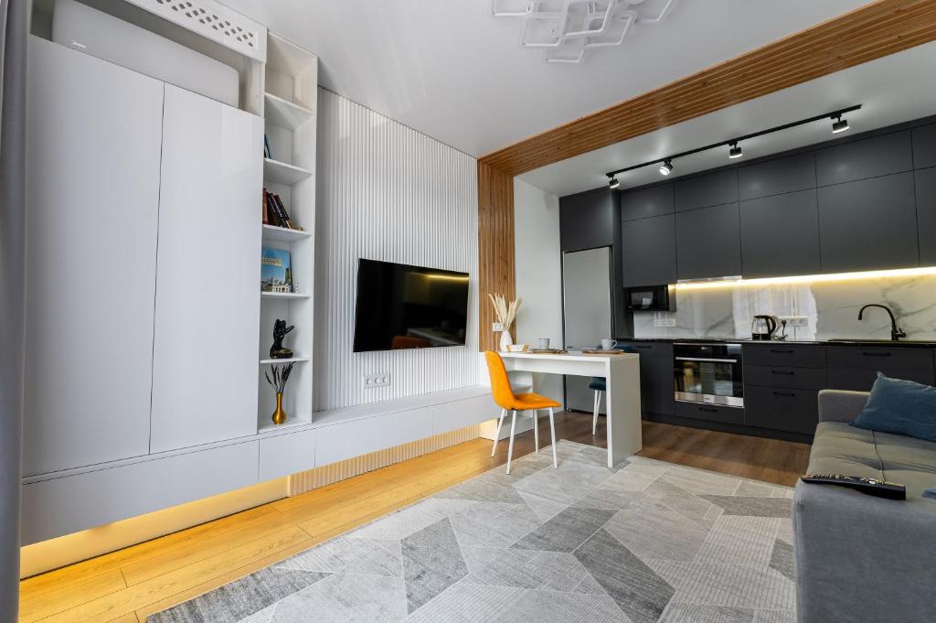 Кухня или мини-кухня в Angleterre Apartment Astana
