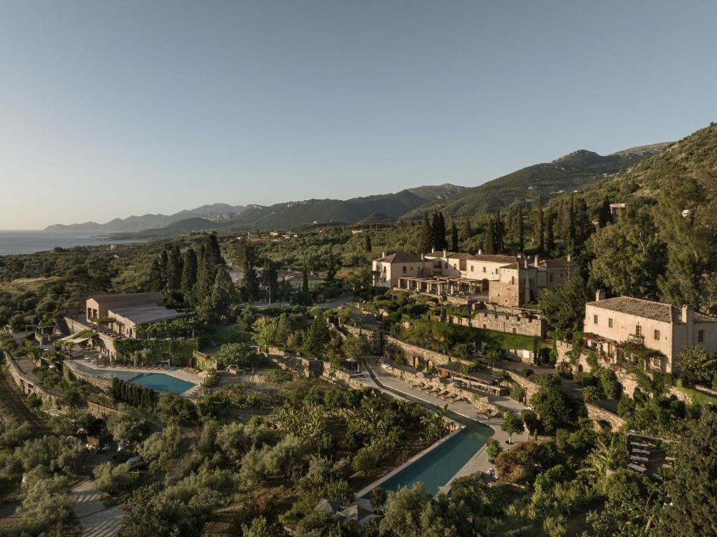 an aerial view of a town with a river and mountains at Kinsterna Hotel in Monemvasia