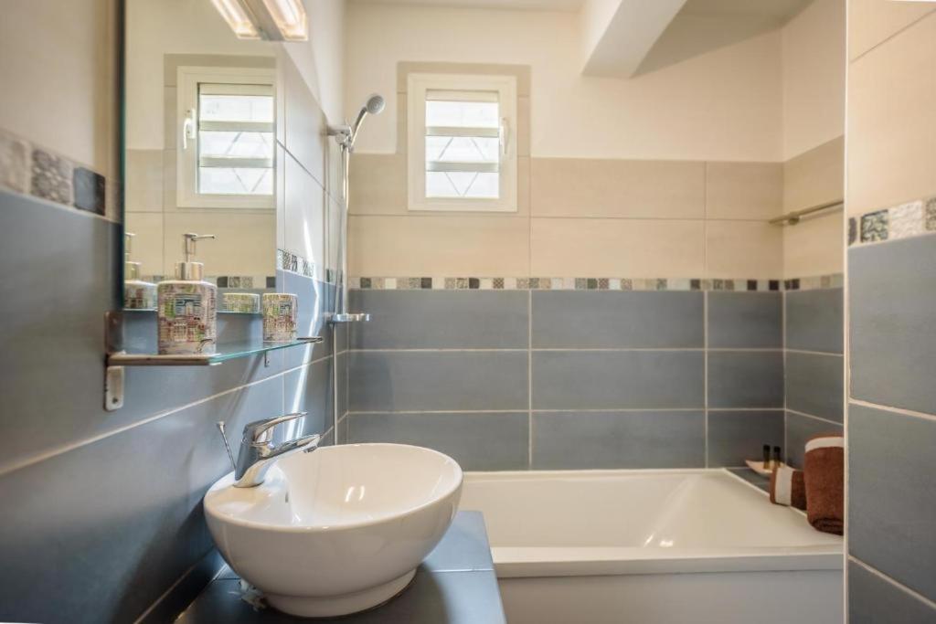 Koupelna v ubytování 1A - Chambres et Appartements au calme - Centre St Denis - Barachois