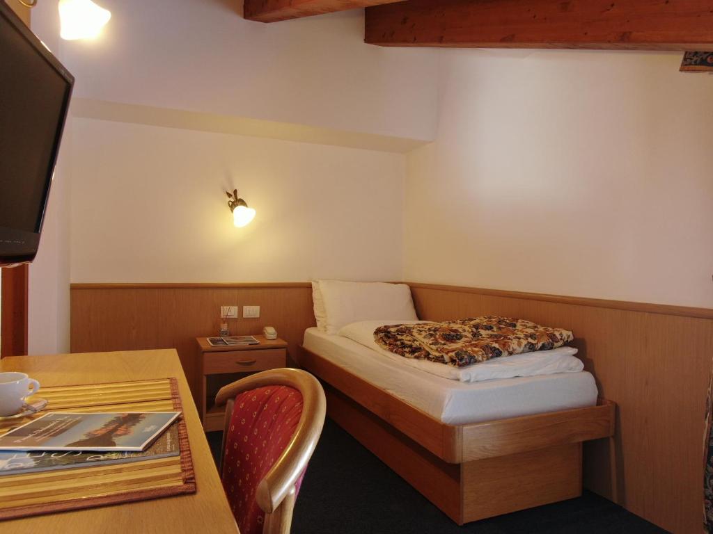 Postel nebo postele na pokoji v ubytování Hotel Fortini