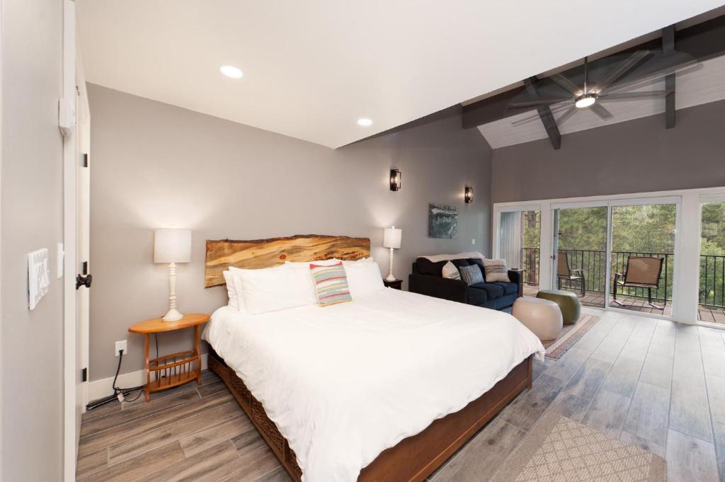 a bedroom with a large bed and a living room at Tamarron HighPoint - 571 in Durango