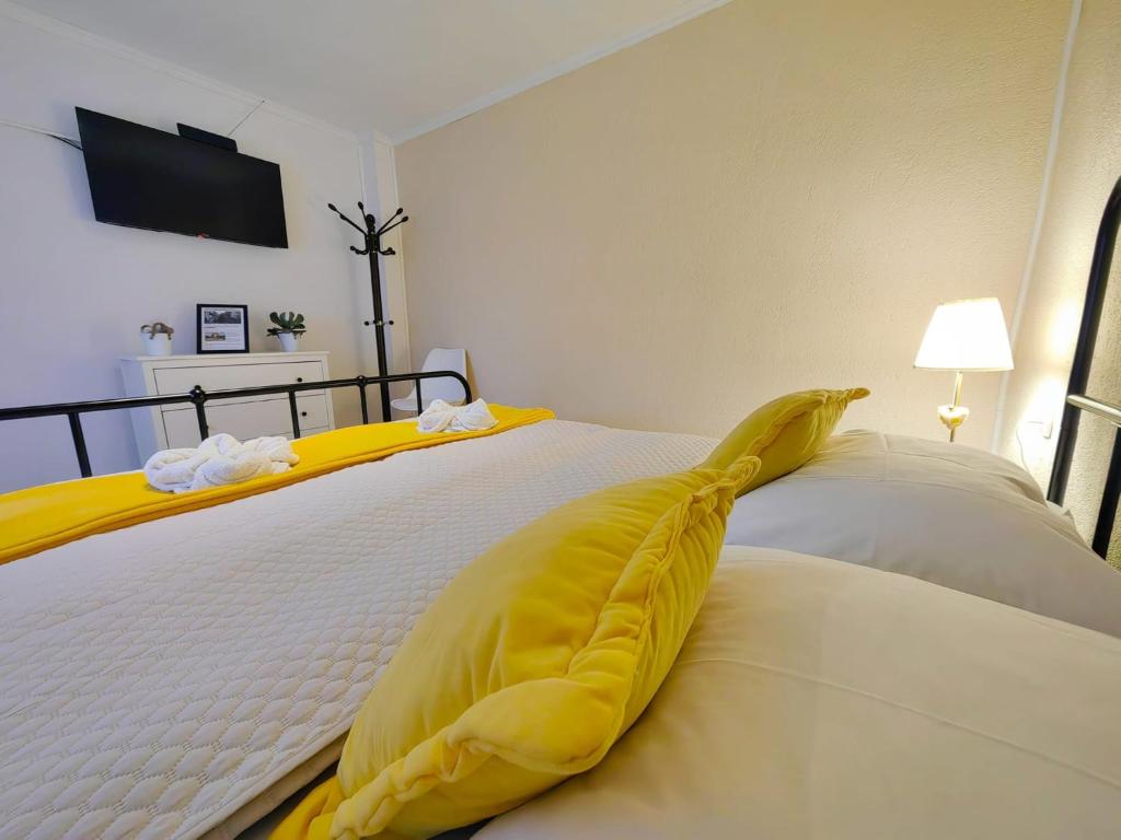 Postel nebo postele na pokoji v ubytování Apartmani Sabina