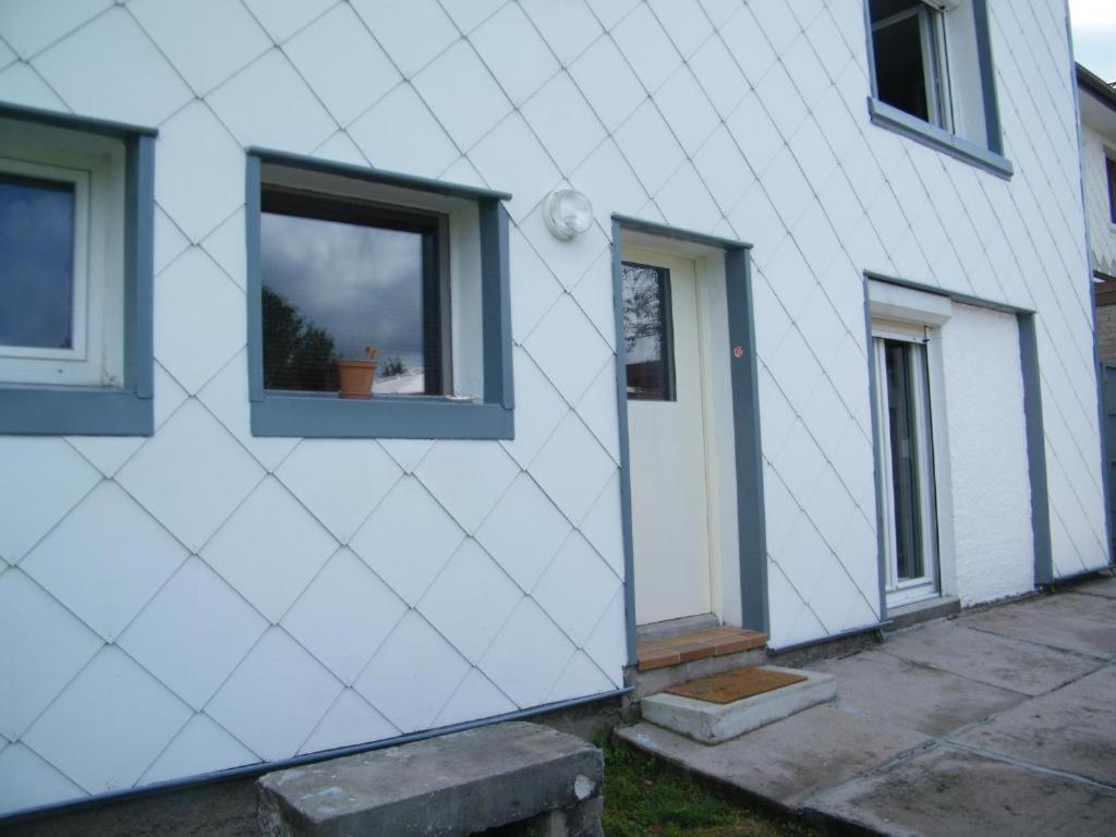 a white house with a window on the side of it at Chez Laurent et Sandrine in Chantraine