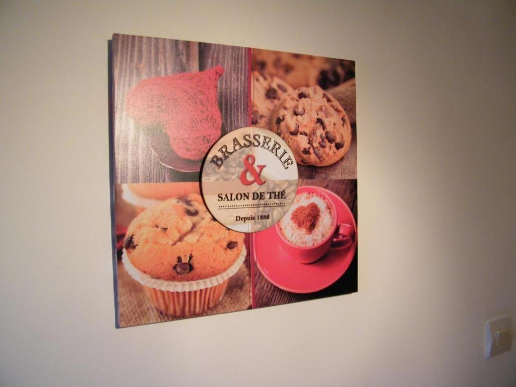 a picture of muffins and a sign on a wall at Chez Laurent et Sandrine in Chantraine