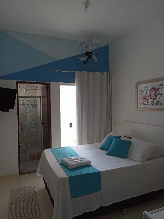 Cama ou camas em um quarto em Pousada Antares