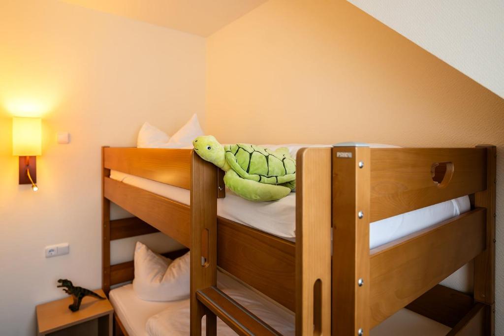Voodi või voodid majutusasutuse Zeitgeist Rathen by STEIGER Hotels toas