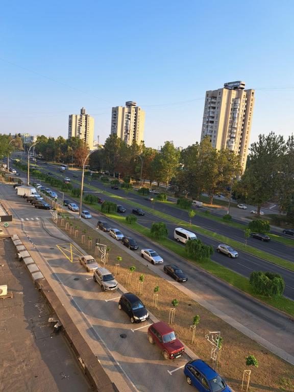 a highway with cars parked in a parking lot at Dacia in Chişinău