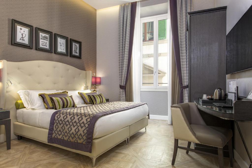 Postel nebo postele na pokoji v ubytování Hotel Spadai