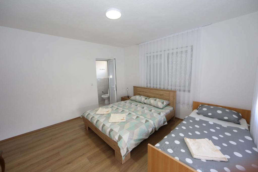 Postel nebo postele na pokoji v ubytování Villa Rita