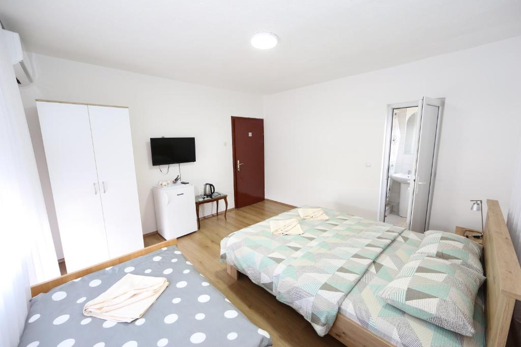 Postel nebo postele na pokoji v ubytování Villa Rita