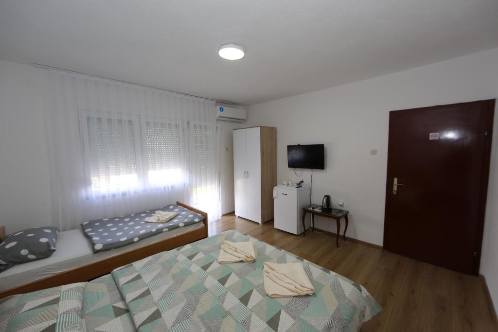 Postel nebo postele na pokoji v ubytování Villa Rita