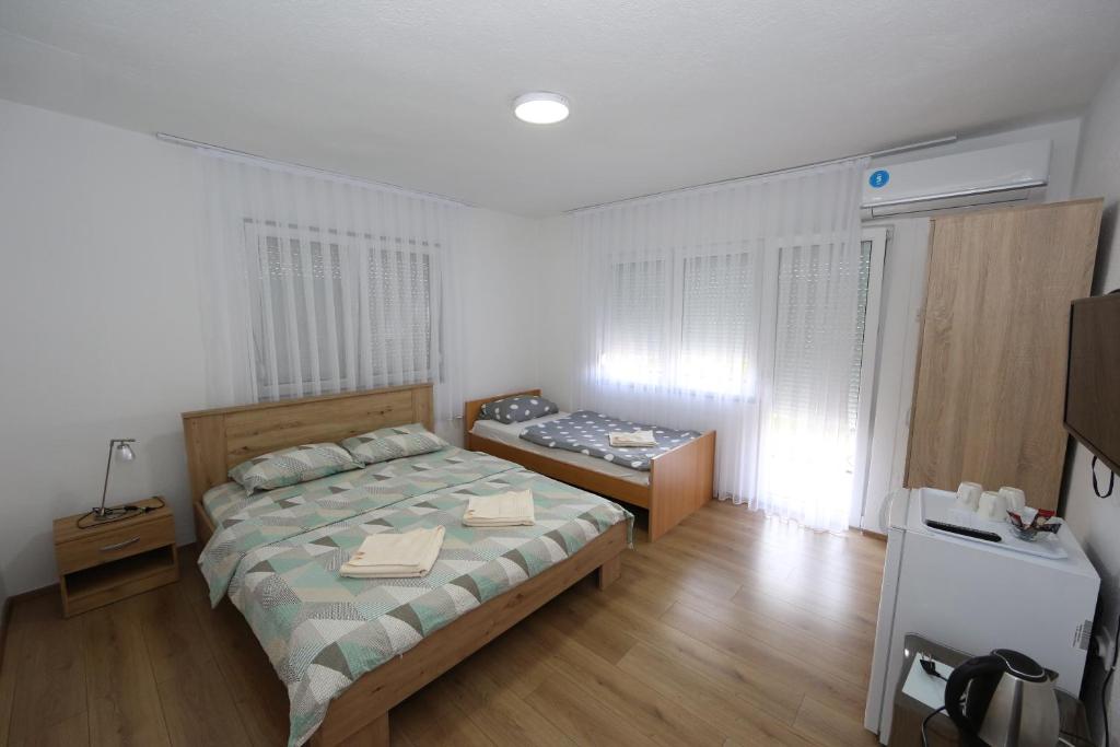 Postel nebo postele na pokoji v ubytování Villa Rita