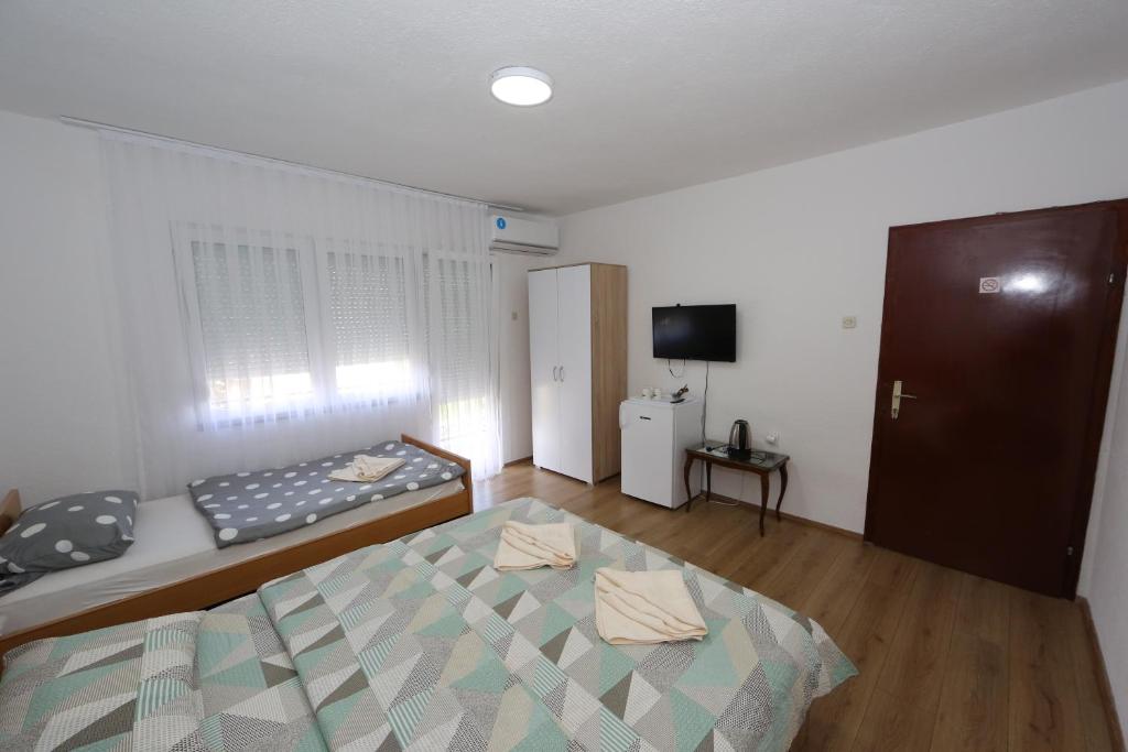 Postel nebo postele na pokoji v ubytování Villa Rita