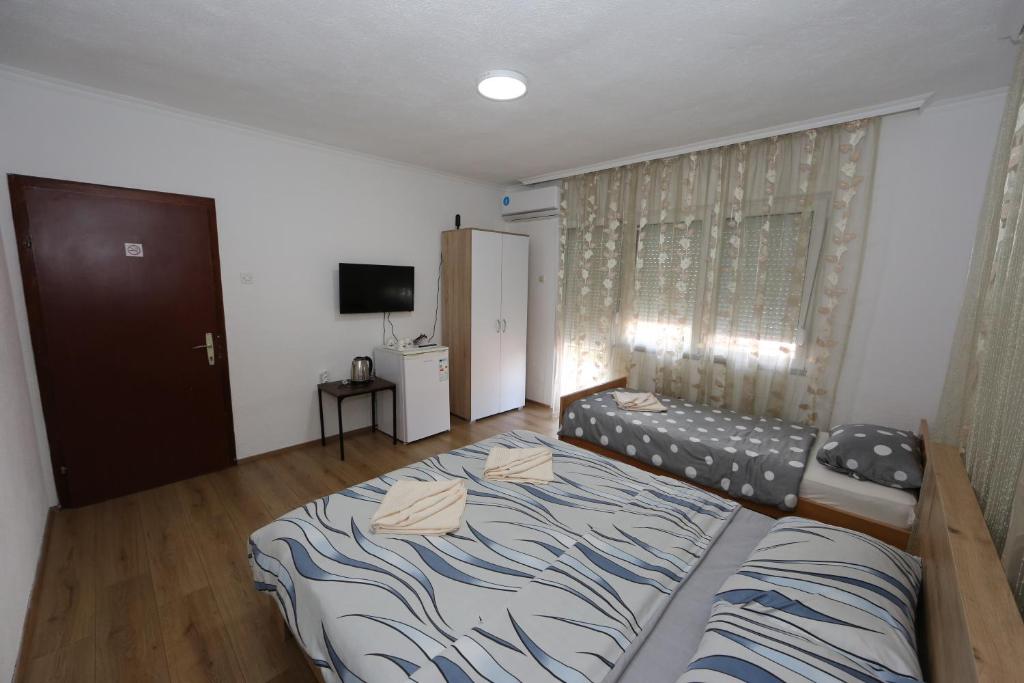 Postel nebo postele na pokoji v ubytování Villa Rita