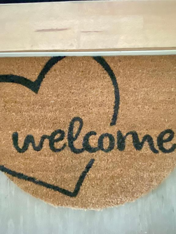 a welcome mat with a heart and the word welcome at Harzperle 2 II zentrales 3 Zi Apartment II Familien in Bad Harzburg