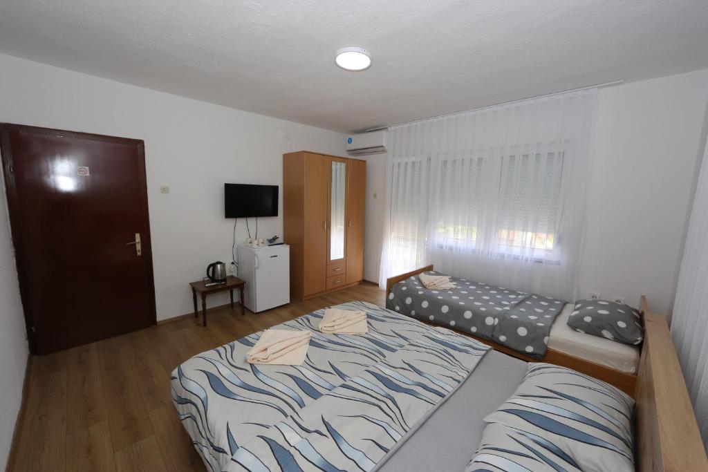 Postel nebo postele na pokoji v ubytování Villa Rita