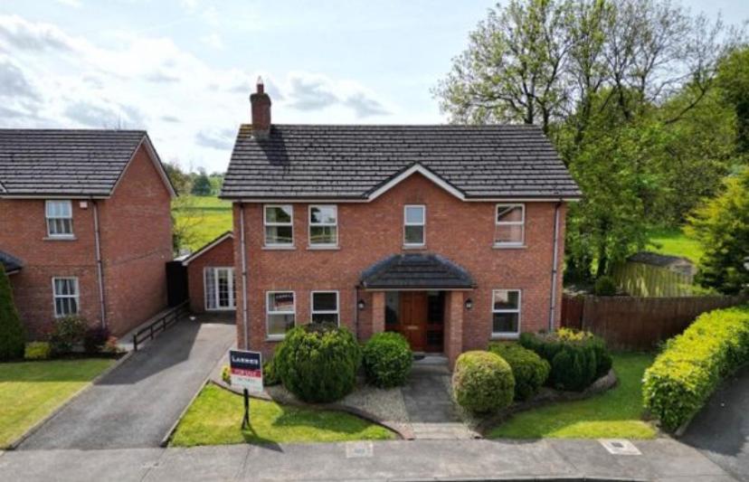 a large red brick house with a driveway at Stunning 5-Bed House in Clones in Cluain Eois