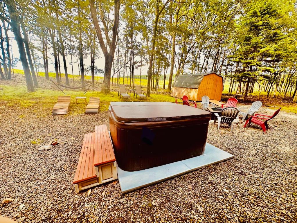 a large television sitting on top of a picnic table at Sauna, Games,Grill, View,Lake,Pool,TVs in Albrightsville